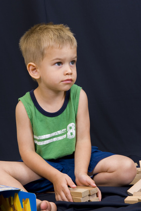 Boy playing with wood blocks